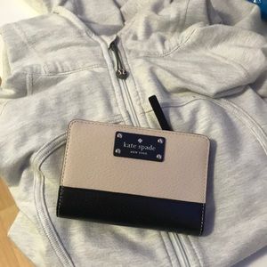 Lululemon jacket and Kate Spade wallet